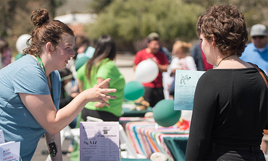 Assisting students at Cougar Welcome Days registration event