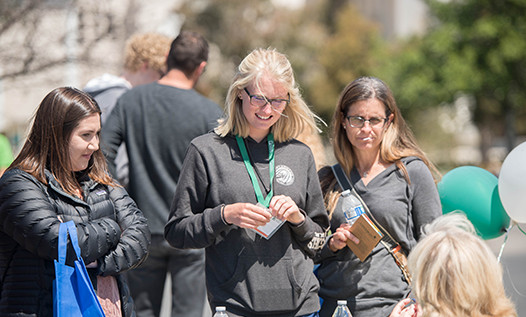 Assisting students at Cougar Welcome Days registration event